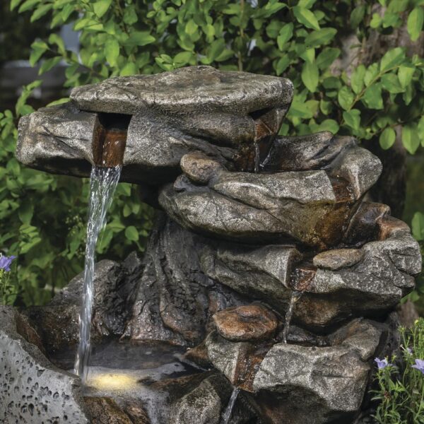 Enchanted Garden 23.62 inches Tiered Riverview Park Outdoor Water Fountain This spherical Riverview Park Water Fountain will add a beautiful dramatic element to your garden. The stepping stones of the waterfall portion of the fountain beckon you to come closer to absorb the peaceful sound it makes. Two pools of water are lit with LED lights, adding a warm glow to your fountain in a shady spot in your yard, or throughout the evening. Crafted from polyresin and fiberglass, it will last many years if stored safe from frost during the harshest Winter weather. Material Composite Flow Rate 290.62 gallon per hour Includes Warm white LED lights, Pump Capacity 2.95 gallon (US) Number of Tiers 7 Color/Finish Beige Dimensions 23.62 in H x 20.67 in W x 19.69 in D Weight 22 pounds Crafted of polyresin and fiberglass Includes 5 warm white LED lights Includes a 6 ft. power cord for the water pump For outside use only
