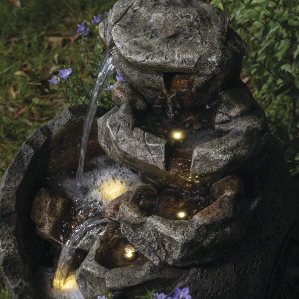 Enchanted Garden 23.62 inches Tiered Riverview Park Outdoor Water Fountain This spherical Riverview Park Water Fountain will add a beautiful dramatic element to your garden. The stepping stones of the waterfall portion of the fountain beckon you to come closer to absorb the peaceful sound it makes. Two pools of water are lit with LED lights, adding a warm glow to your fountain in a shady spot in your yard, or throughout the evening. Crafted from polyresin and fiberglass, it will last many years if stored safe from frost during the harshest Winter weather. Material Composite Flow Rate 290.62 gallon per hour Includes Warm white LED lights, Pump Capacity 2.95 gallon (US) Number of Tiers 7 Color/Finish Beige Dimensions 23.62 in H x 20.67 in W x 19.69 in D Weight 22 pounds Crafted of polyresin and fiberglass Includes 5 warm white LED lights Includes a 6 ft. power cord for the water pump For outside use only