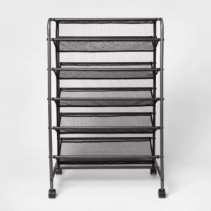Double Sided Rolling Shoe Rack Black - Room Essentials™ Keep your shoes neatly organized and off the floor with the Double Sided Rolling Shoe Rack from Room Essentials™. Crafted from solid steel for durability and lasting use, this black metal shoe closet features a double-sided shelf design that can easily hold up to 30 pairs of shoes. The breathable mesh lining offers ample ventilation and keeps the shoes from falling out of the rack, while the attached rolling casters make it easy to move it from one room to another. Perfect for organizing men's, women's or kids shoes, this portable shoe closet offers ample space to accommodate different styles of shoes while easily blending with any style of decor.