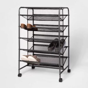 Double Sided Rolling Shoe Rack Black - Room Essentials™ Keep your shoes neatly organized and off the floor with the Double Sided Rolling Shoe Rack from Room Essentials™. Crafted from solid steel for durability and lasting use, this black metal shoe closet features a double-sided shelf design that can easily hold up to 30 pairs of shoes. The breathable mesh lining offers ample ventilation and keeps the shoes from falling out of the rack, while the attached rolling casters make it easy to move it from one room to another. Perfect for organizing men's, women's or kids shoes, this portable shoe closet offers ample space to accommodate different styles of shoes while easily blending with any style of decor.