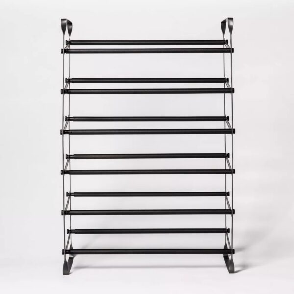 Expandable Shoe Shelf - Room Essentials™ Revamp your entryway with this Expandable Shoe Shelf from Room Essentials™ that helps keep your shoes organized in modern style. Designed with a metal frame, this expandable shoe shelf is fitted with two rods on each of the six shelves to make it convenient to place your footwear while adding a sleek look to your space. Long enough to hold up to 30 shoes, this black shoe shelf helps keep your footwear off the floor to maintain a neat space.