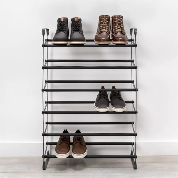 Expandable Shoe Shelf - Room Essentials™ Revamp your entryway with this Expandable Shoe Shelf from Room Essentials™ that helps keep your shoes organized in modern style. Designed with a metal frame, this expandable shoe shelf is fitted with two rods on each of the six shelves to make it convenient to place your footwear while adding a sleek look to your space. Long enough to hold up to 30 shoes, this black shoe shelf helps keep your footwear off the floor to maintain a neat space.
